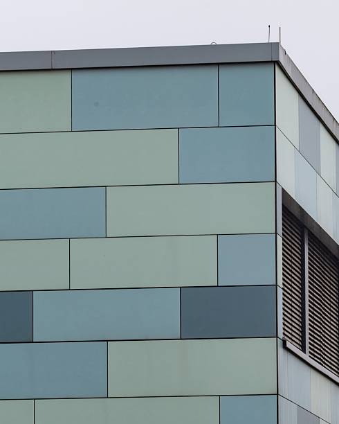 istock Modern building exterior featuring blue and green panels with a unique design 2252562571