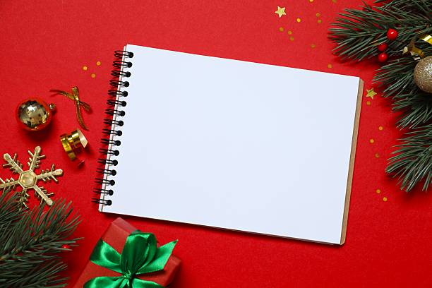 istock Blank notepad festive Christmas decorations, perfect for planning holidays and New Year's resolutions in a cozy holiday setting 2252565686