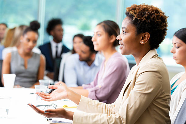 istock Diverse professionals in discussion during a business meeting or educational setting. 2252568273