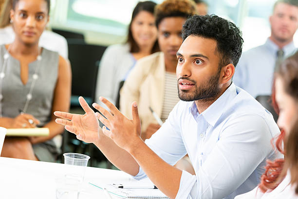 istock Man explaining an idea during a business meeting, gesturing with his hands. 2252568296