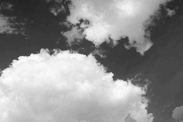 istock Clouds in the sky. Cloudy sky. Sky with big clouds. Black and white sky background. 2252568574