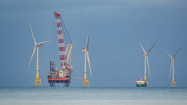 istock Wind farm installation vessel servicing wind turbines 2252572252