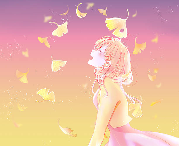 istock A woman laughing as ginkgo leaves fall 2252572578