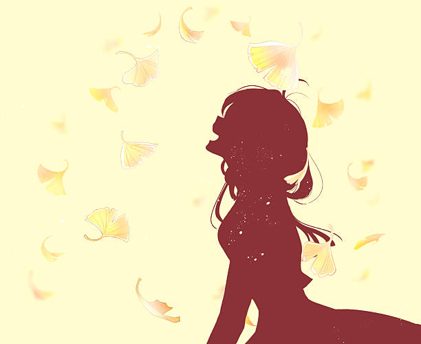 istock A woman laughing as ginkgo leaves fall 2252572627