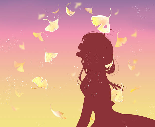 istock A woman laughing as ginkgo leaves fall 2252572653