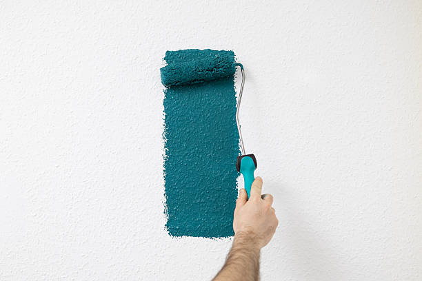 istock Paint roller in the process of applying paint. Free space. 2252577242