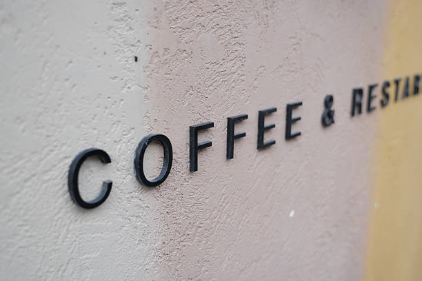 istock Coffee and restaurant sign on a textured wall 2252578297