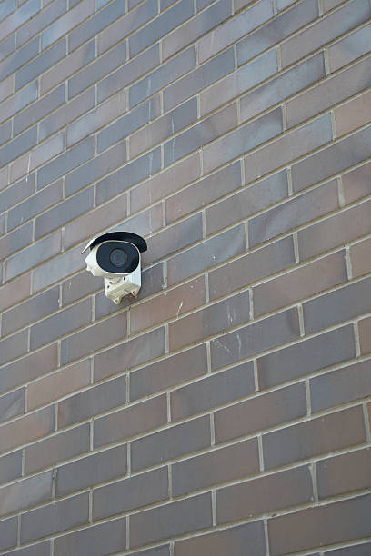 istock Outdoor security camera mounted on a brick wall 2252579895