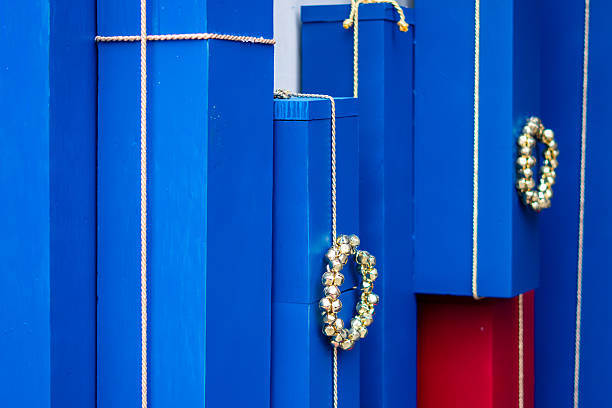 istock Christmas storefront decoration with blue gift boxes tied with string and golden decorative rings elements 2252581274