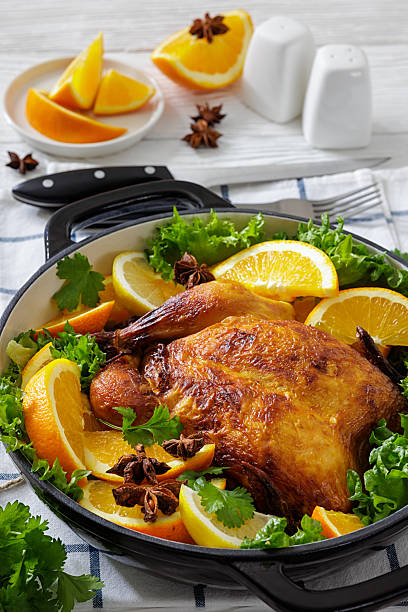 istock Whole roasted chicken in baking dish with citrus 2252581868