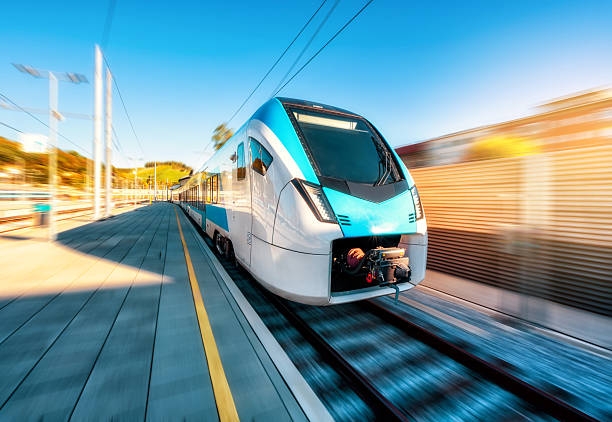 istock High-speed blue passenger train moving at railway station 2252584503