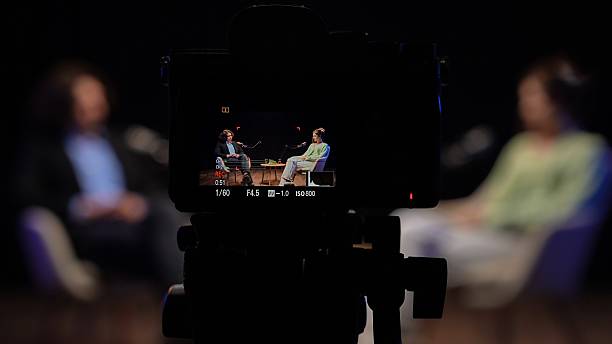 Engaging Conversation Unfolds in the Podcast Studio as Experts Share Insights on Storytelling