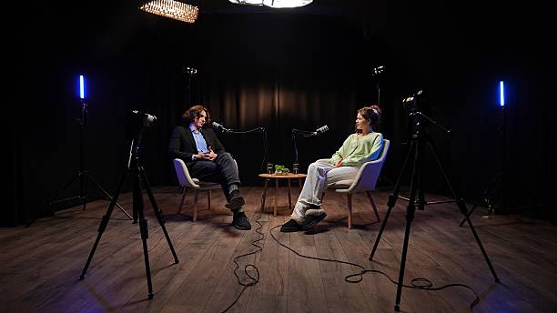 istock Engaging Conversation Unfolds Between Podcast Host and Expert in a Modern Recording Studio 2252584913