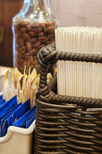 Napkins, sugar, and sweetener on a bar table