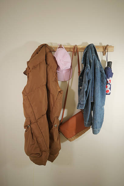 istock Cozy collection of outerwear and accessories on a wall hook 2252585665