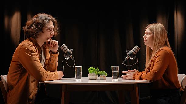 istock Engaging Dialogue Unfolds in a Cozy Podcast Studio Between Two Influencers 2252586527