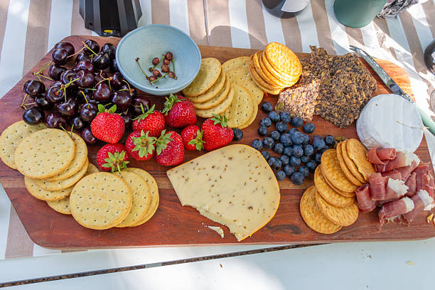 cheese and fruit platter on wooden board