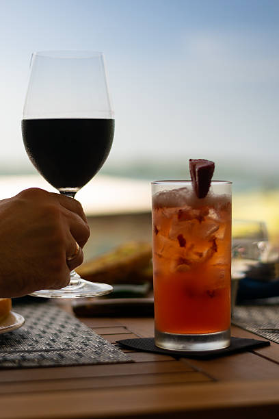istock vertical image of cocktail and wine glass over table setting 2252590583