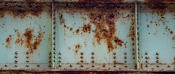 istock Corroded steel background for construction. Rust stains for repair services design. Metal panel texture for construction branding. Grunge rust pattern for design use. Bridge corrosion for engineering. 2252590767