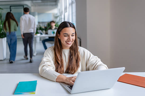 istock Group of adults working in a modern office setting with technology and teamwork during the day 2252591529