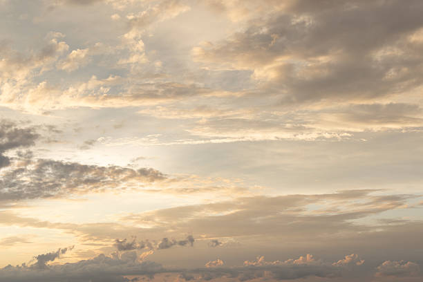 A tranquil sunset fills the sky with warm golden light, soft clouds, and a peaceful horizon, evoking calm and serene mood suitable for nature, travel, and ambience themes.