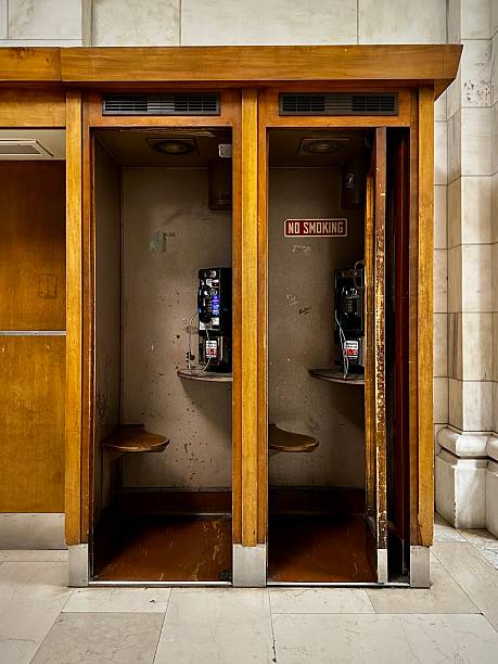 New York, New York, USA. Dec 13, 2025 - Public phone booths in the New York Public Library.