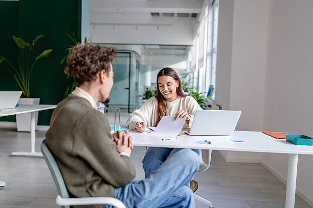 istock Professional adults engage in work activities in a modern office setting during daytime hours 2252601159