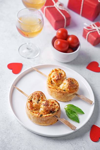 istock Basil cheese tomato puff pastry hearts for Valentine's day holidays 2252602170