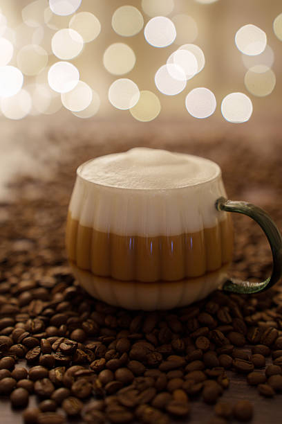 istock coffee beans and a soft, bokeh light background creating a festive and inviting atmosphere on a wooden surface, scene, foamy, ambiance, delight 2252603286