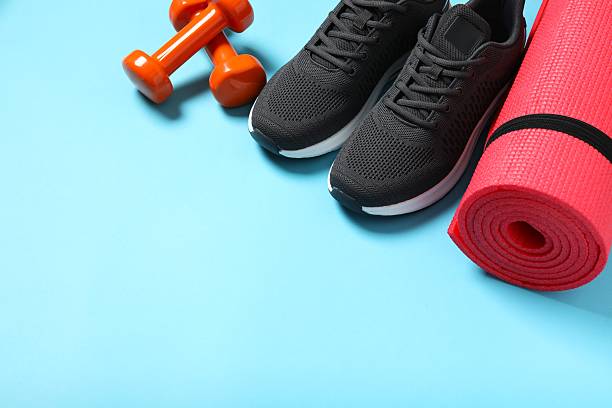 istock Sport equipment on color background, top view 2252604126