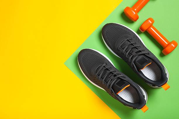 istock Sport equipment on color background, top view 2252604190