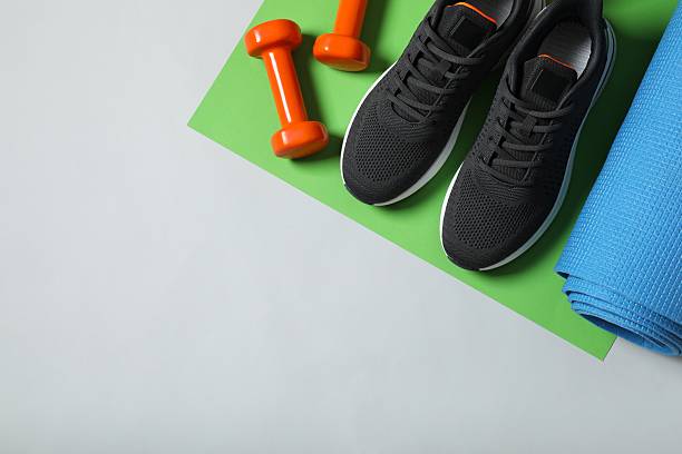 istock Sport equipment on color background, top view 2252604225