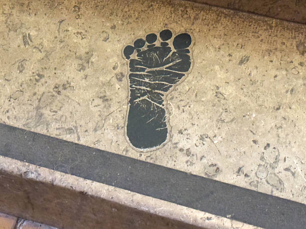 Weathered footprint on stone surface