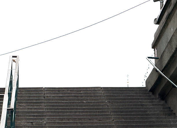 Concrete staircase leading to white sky