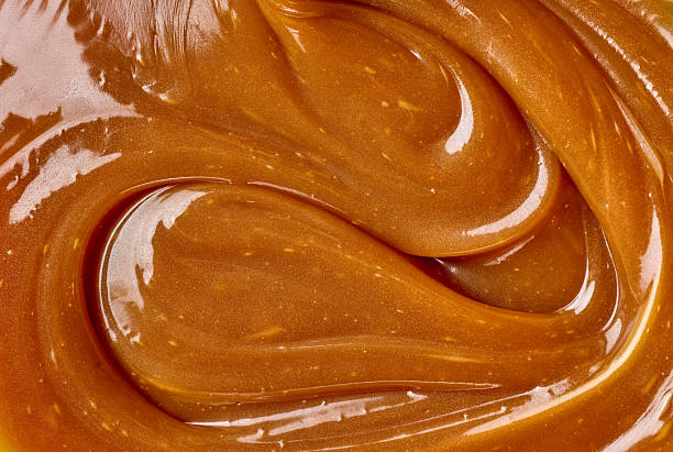 istock freshly cooked caramel sauce background 2252604678