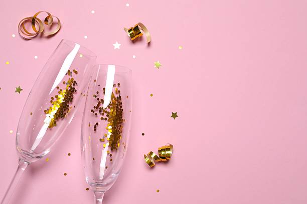 istock Festive background with champagne glasses and confetti 2252606233