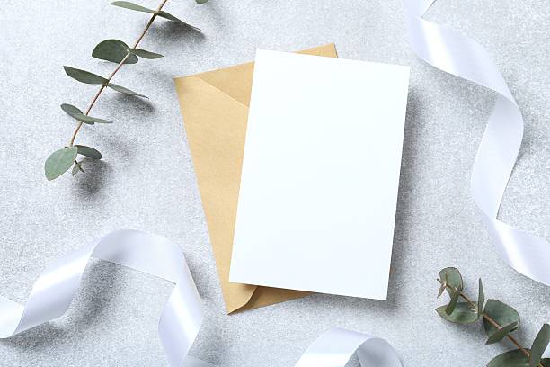 istock Green eucalyptus branches with paper card on marble background 2252606599