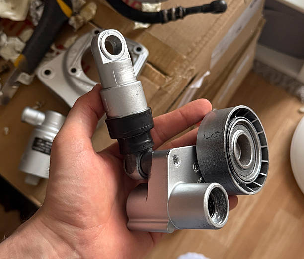 Close-up of a mechanical part in hand, showcasing intricate design and functionality during repair