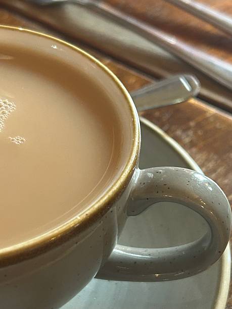 istock Warm Cup Of Tea In A Ceramic Cup With Foam And Bubbles On Surface 2252608697