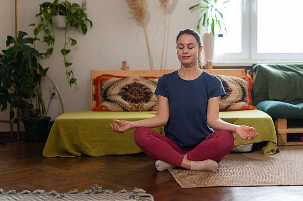 istock Woman practicing meditation for mindfulness and focus at home 2252608804