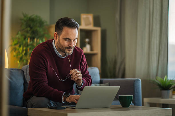 istock Man working from home happy on laptop 2252609370
