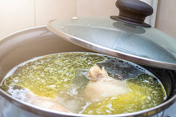 istock preparing delicious chicken broth in a silver pan in the home kitchen. an ingredient for further preparation of soup. light rich broth is good for the diet 2252609665