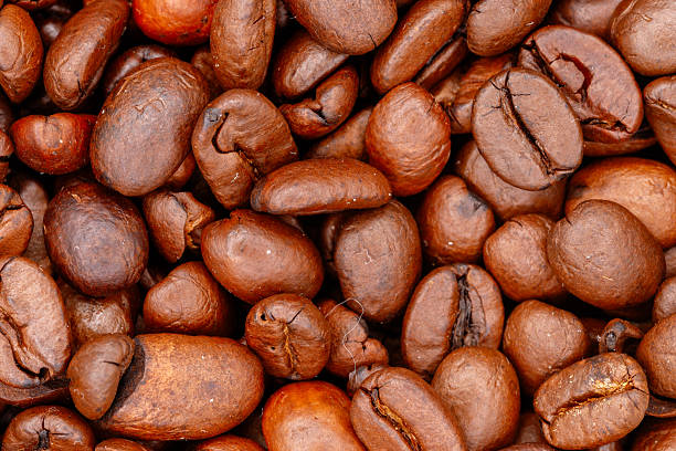istock Aromatic roasted coffee beans background texture food 2252612299