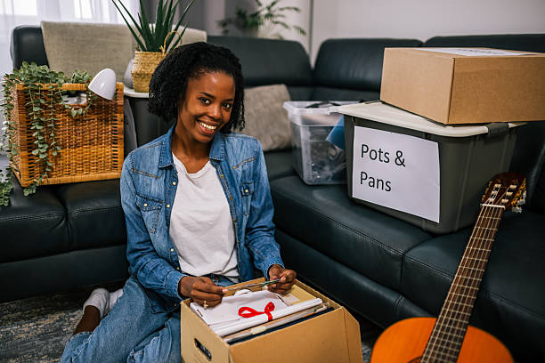 istock Woman Unpacking in New Apartment 2252615908