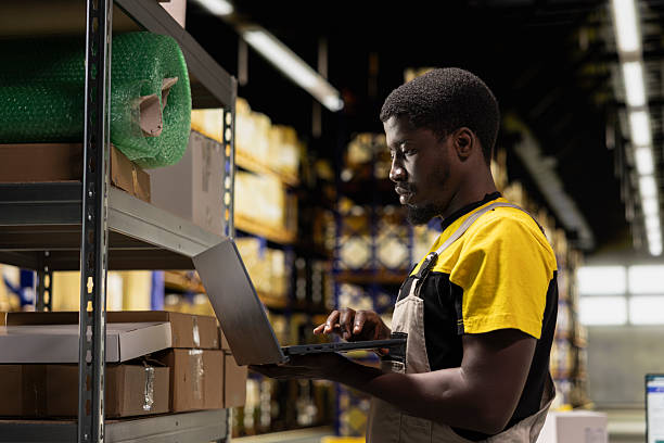istock African american male staff organizing packages on storage racks 2252617619