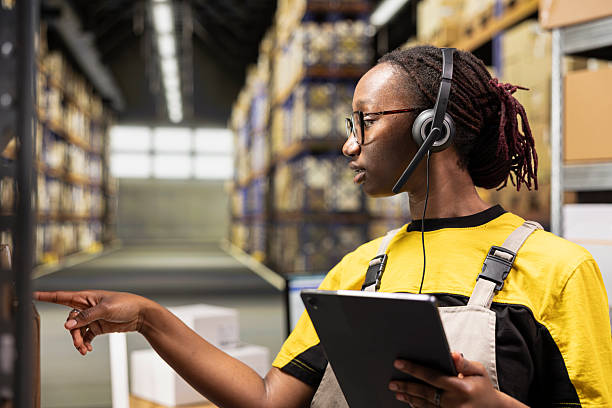 istock Customer support employee assisting clients in an industrial logistics hub 2252619153
