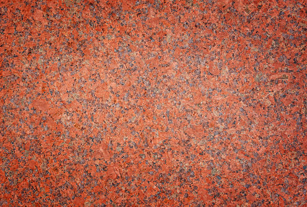 istock Natural red granite stone texture with detailed mineral pattern and rough polished surface. High resolution rock background with visible grains and speckles, suitable for architecture, construction, interior design 2252620640