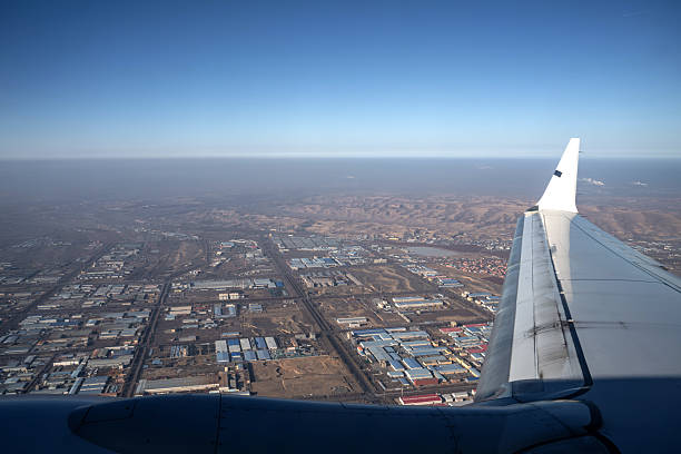 Viewing houses and wings on the plain from an airplane
