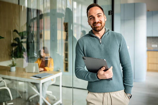 istock Colleagues work together in a modern office with technology and engagement between employees 2252621544