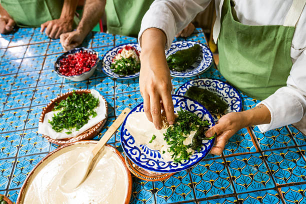 Close up of chef hands cooking Chiles en Nogada